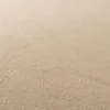 A close-up, textured view of beige fabric, likely a carpet or upholstery. Náhled obrázku produktu