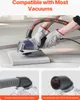 A person wearing gloves is using a grinder with a dust collection attachment connected to a vacuum hose. Náhľad obrázku produktu
