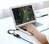 A person is playing a video game on a laptop, with an Ethernet adapter connected to the laptop and an Ethernet cable plugged into the adapter. Voir les images du produit