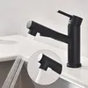A black kitchen faucet with water spraying from its nozzle, shown in a close-up view over a sink. Produktbild-Vorschau