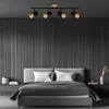 A bedroom scene with a bed and a spotlight fixture. Produktbild-Vorschau