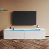 A modern white TV stand with blue LED lighting is shown in a living room setting with a large TV mounted on the wall above it. Anteprima dell’immagine prodotto