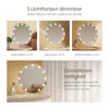 Collage of images showing a makeup mirror with different light settings and adjustable brightness. Produktbild-Vorschau
