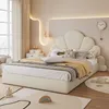 A bedroom scene with a bed, pillows, and decor. Produktbild-Vorschau