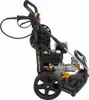 A side view of a black and silver pressure washer with wheels and a hose. Náhled obrázku produktu