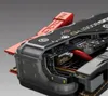 A close-up, cutaway view of a car jump starter, revealing its internal electronic components and wiring. Produktbild-Vorschau