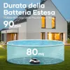 A robotic pool cleaner is shown in an above-ground pool in a backyard setting, with a house in the background. Náhled obrázku produktu