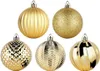 Five gold Christmas ornaments are arranged on a white background. Náhľad obrázku produktu