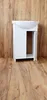 A white bathroom vanity with a sink is shown against a wooden wall and floor. Anteprima dell’immagine prodotto
