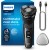 A Philips electric shaver and its accessories are displayed on a white background, with the product's packaging on the left. Podgląd zdjęcia produktu