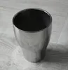 A silver ceramic pot on a light wooden floor. Podgląd zdjęcia produktu