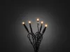 A close-up shot of a string of amber LED lights against a dark gray gradient background. Voir les images du produit