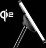A close-up shot of a smartphone attached to a wireless charger, with the Qi2 logo visible. Produktbild-Vorschau