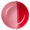 A top-down view of a ceramic bowl with a split color design. Produktbild-Vorschau