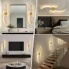 A collage of four images showing modern LED wall lights in different interior settings: a bathroom, a bedroom, a living room with a TV, and a staircase. Voir les images du produit