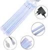 A product shot of LED meteor shower lights with a power adapter and plug. Produktbild-Vorschau