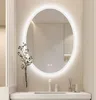 A modern oval LED mirror above a sink in a bathroom. Náhled obrázku produktu
