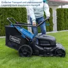 A person is using a lawnmower in a garden. Produktbild-Vorschau