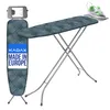A KADAX ironing board with an iron resting on its heat-resistant tray, set against a white background. Náhled obrázku produktu