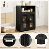 A bathroom or storage area with a black cabinet and other bathroom items. Anteprima dell’immagine prodotto
