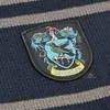 A close-up of a knitted scarf with the Ravenclaw crest patch. Anteprima dell’immagine prodotto