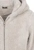 A close-up view of a fuzzy sand-colored jacket with a zipper. Produktbild-Vorschau