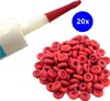 A close-up of a pile of red sealing caps next to a sealant tube. Produktbild-Vorschau