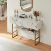 A console table with marble-look top and gold legs, decorated with candles, books, and a vase of dried flowers. Náhled obrázku produktu