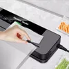 A hand is shown placing a vacuum seal bag into a vacuum sealer machine. Náhľad obrázku produktu