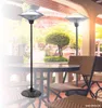 Outdoor patio setting with tables, chairs, and patio heaters. Produktbild-Vorschau
