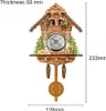 A decorative cuckoo clock with a pendulum and weights, shown against a white background with dimensions indicated. Náhled obrázku produktu