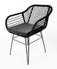 A black chair with a woven back and a cushion, photographed against a white background. Produktbild-Vorschau