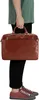 A person is holding a brown leather briefcase. Produktbild-Vorschau