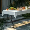A white tablecloth-covered folding table set up outdoors with food and drinks, suggesting a party or buffet setting. Náhľad obrázku produktu