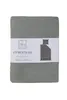 A folded duvet and pillow set on a white background, with a product label. Produktbild-Vorschau