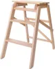 A wooden step stool with three steps against a white background. Podgląd zdjęcia produktu