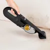 A hand is holding a black handheld vacuum cleaner and cleaning a light-colored sofa with visible dirt. Produktbild-Vorschau