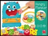 The image shows the packaging for a children's toy called 'Hungry Monster'. The packaging features a cartoon monster and various toy food pieces. Podgląd zdjęcia produktu