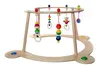 A wooden baby activity gym with hanging toys. Produktbild-Vorschau