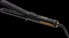 A black hair styling iron with gold accents against a black background. Voir les images du produit