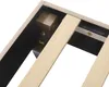 Close-up view of the underside of a bed frame, showing wooden slats and a corner support. Produktbild-Vorschau