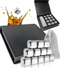 A set of stainless steel whisky stones in a gift box, with a splash of whiskey in the background. Produktbild-Vorschau
