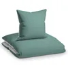 A folded duvet and a pillow, both in teal and light gray colors, are presented on a white background. Produktbild-Vorschau