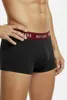 A man wearing black boxer shorts with a red waistband with the brand name 'Mustang' printed on it. Produktbild-Vorschau