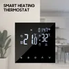 A smart thermostat displayed on a wall with a kitchen in the background. Produktbild-Vorschau