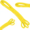 Multiple views of a yellow resistance band. Náhľad obrázku produktu