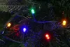 A close-up of colorful LED Christmas lights on a dark green Christmas tree. Produktbild-Vorschau