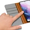 A hand is shown interacting with a phone case. Podgląd zdjęcia produktu