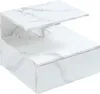 A white marble-look nightstand with a drawer and shelves against a white background. Náhľad obrázku produktu