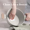 A person's hands are cleaning a pot with a sponge. Text overlays highlight product features. Náhled obrázku produktu